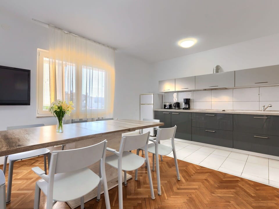 Countertop, Furniture, Cabinetry, Table, Window, Kitchen, Wood, Building, Interior Design, Chair