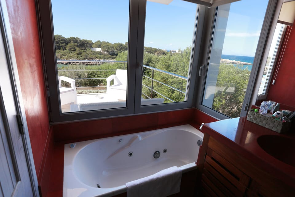 Master suite bathroom.
Jacuzzi bath with sea views