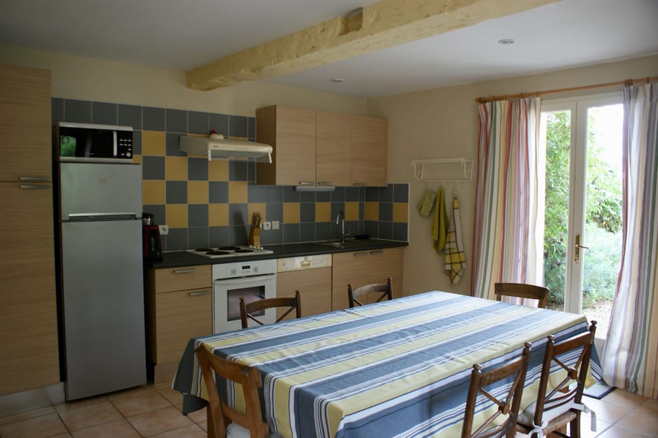 Fully equipped kitchen leading to outside dining terrace