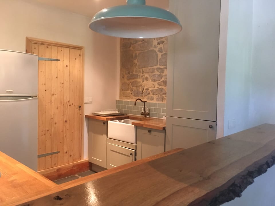 Open plan kitchen with bar top