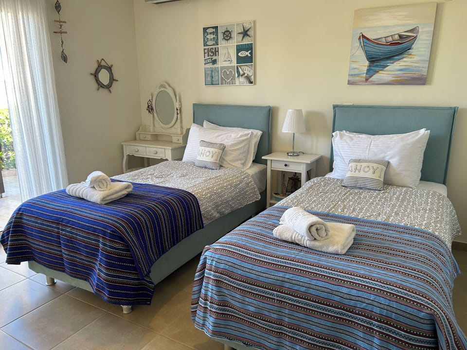 Bed 3 Twin/King bed; French doors to garden; air con; wardrobes, dressing table