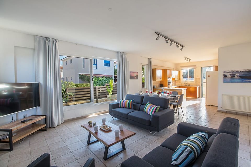 Living room with widescreen TV and large patio doors