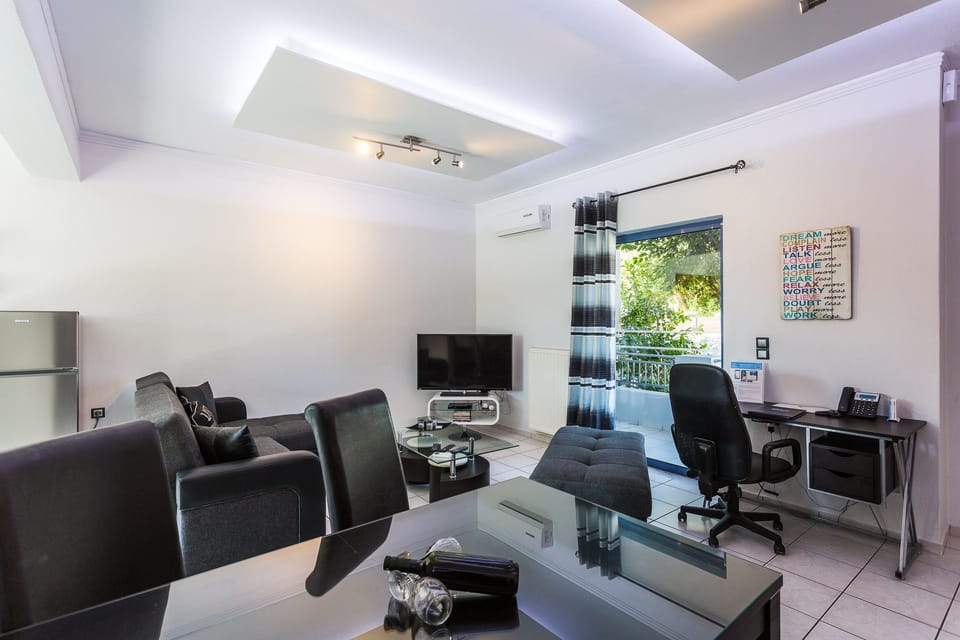 Open plan living room area with direct access to pool and garden