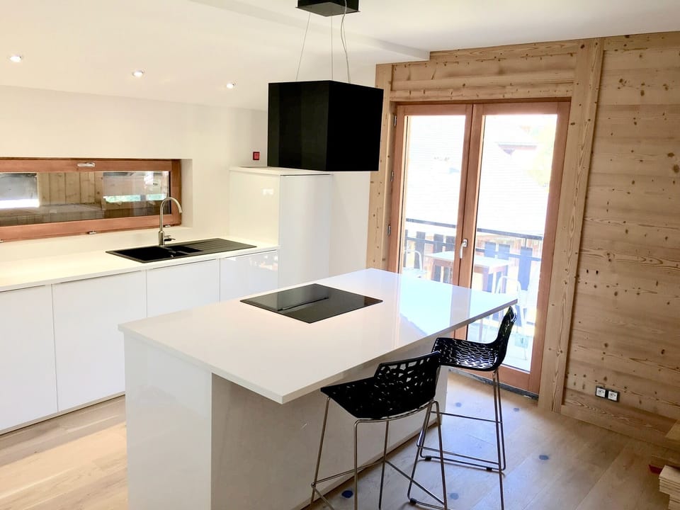 Kitchen with island and bar
