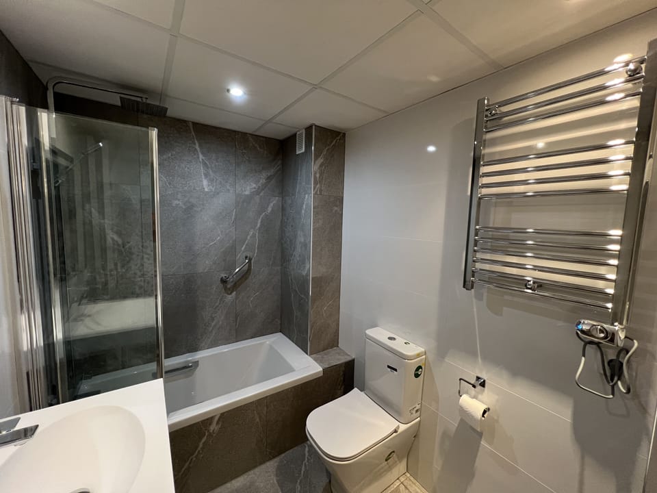 Newly renovated en- suite bathroom with both raindrop and hand held shower
