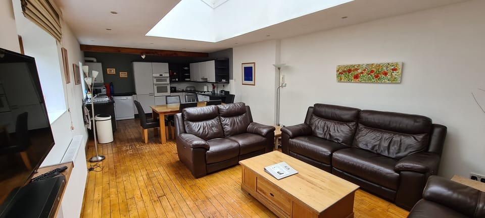 Kitchen beyond living and dining areas