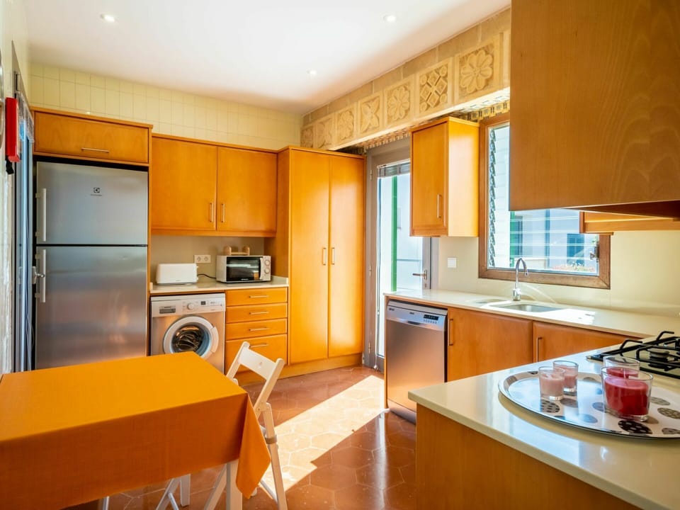 Cabinetry, Countertop, Furniture, Building, Kitchen Appliance, Kitchen Stove, Kitchen, Home Appliance, Wood, Refrigerator