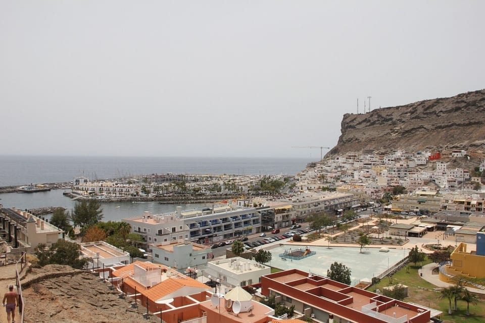 Puerto de Mogan seen from the hillside path.