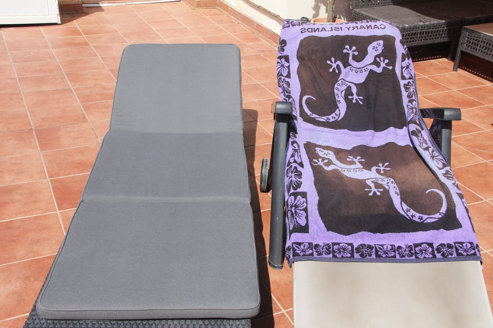 Two comfortable sunbeds on the roof terrace, the best place to relax in the sun.