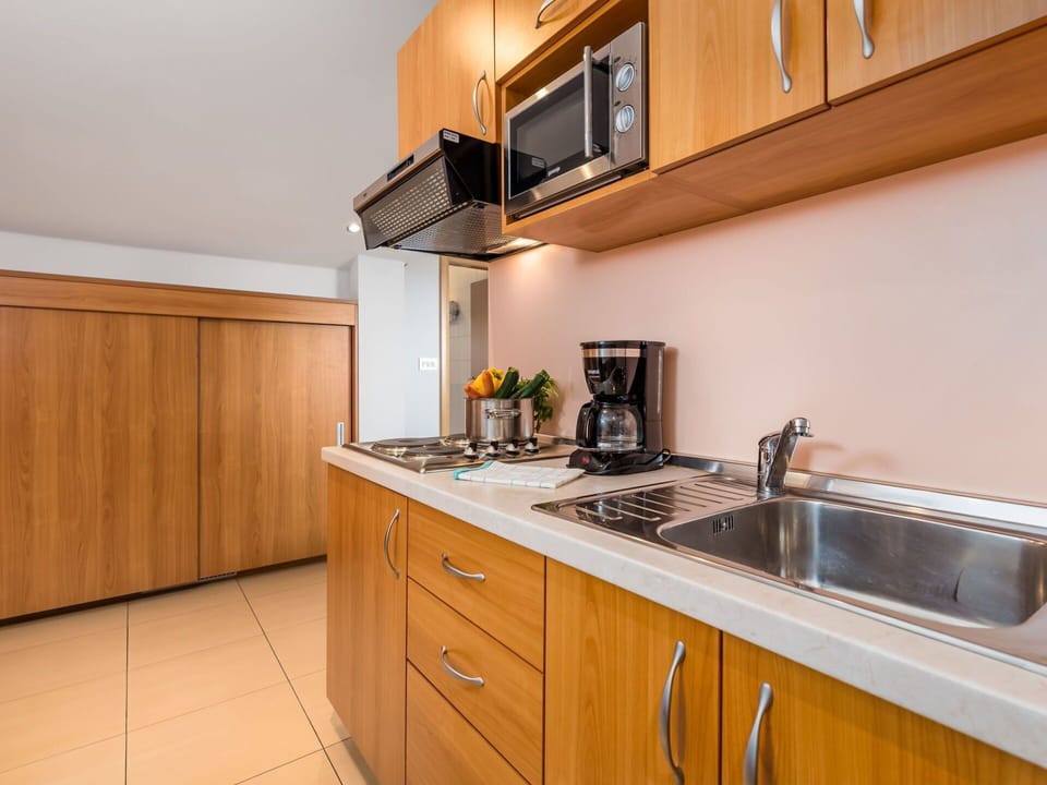 Countertop, Property, Room, Kitchen, Cabinetry, Furniture, Yellow, Building, Real Estate, House