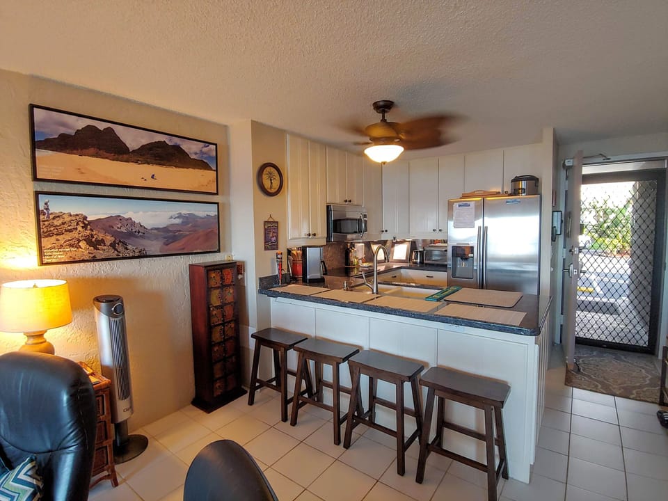 Modern, fully stocked kitchen with granite countertops and new appliances
