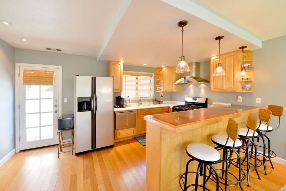 Beautiful well equipped kitchen is open to the living room.