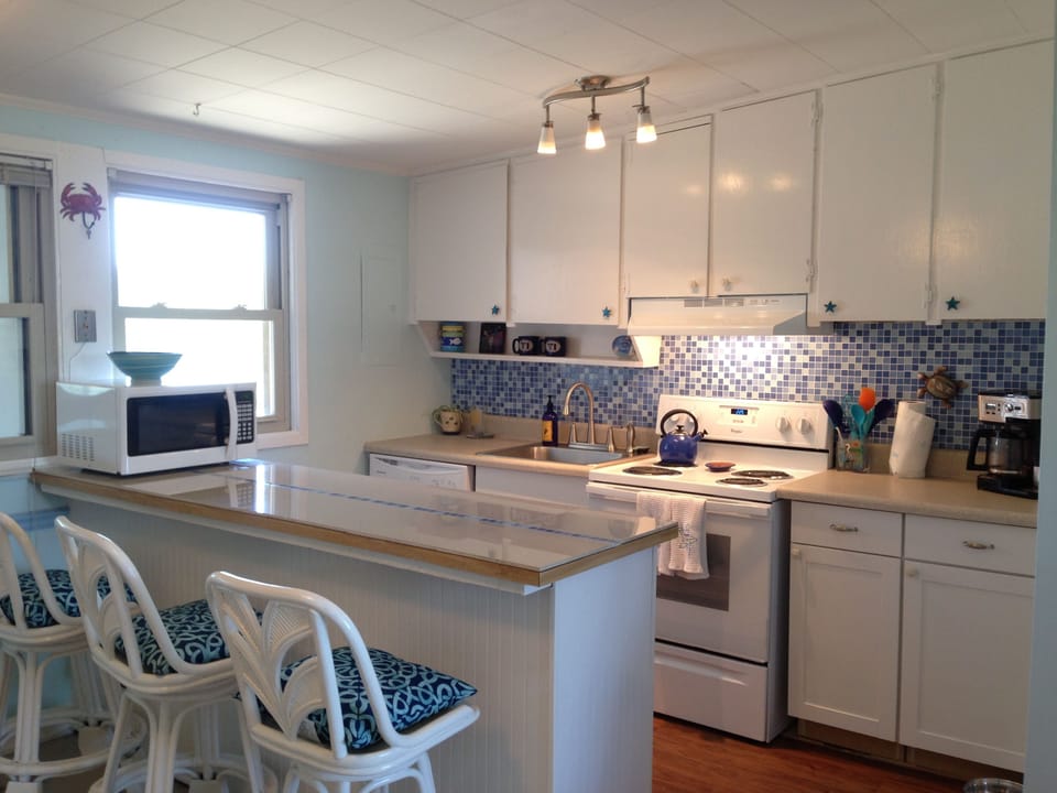 Bright sunny kitchen has been updated with new appliances