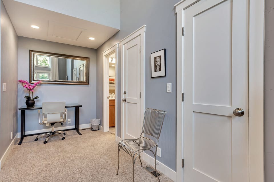 Desk area door opens to on suite Grand Master Bathroom