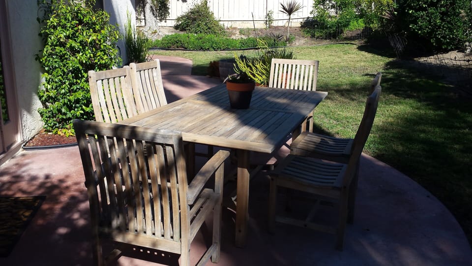 Private Patio with dining for six in fenced back yard