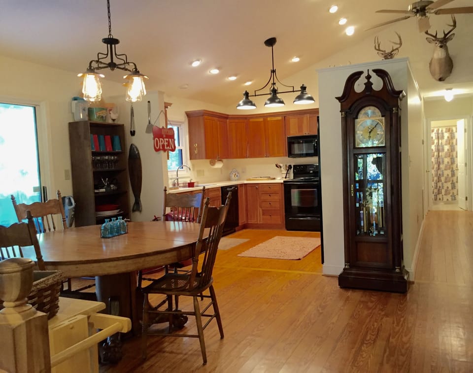 Kitchen opens into two table (6 top round and 10 top long) dining area
