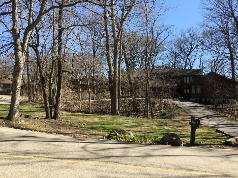 Front of house showing circular driveway.