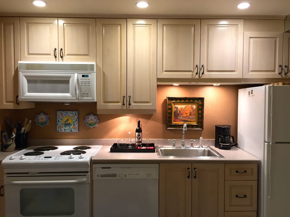 Kitchen is opposite Living Room fireplace.