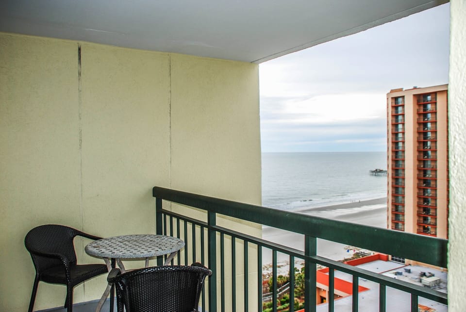 Enjoy quiet moments from the master balcony with private seating for two
