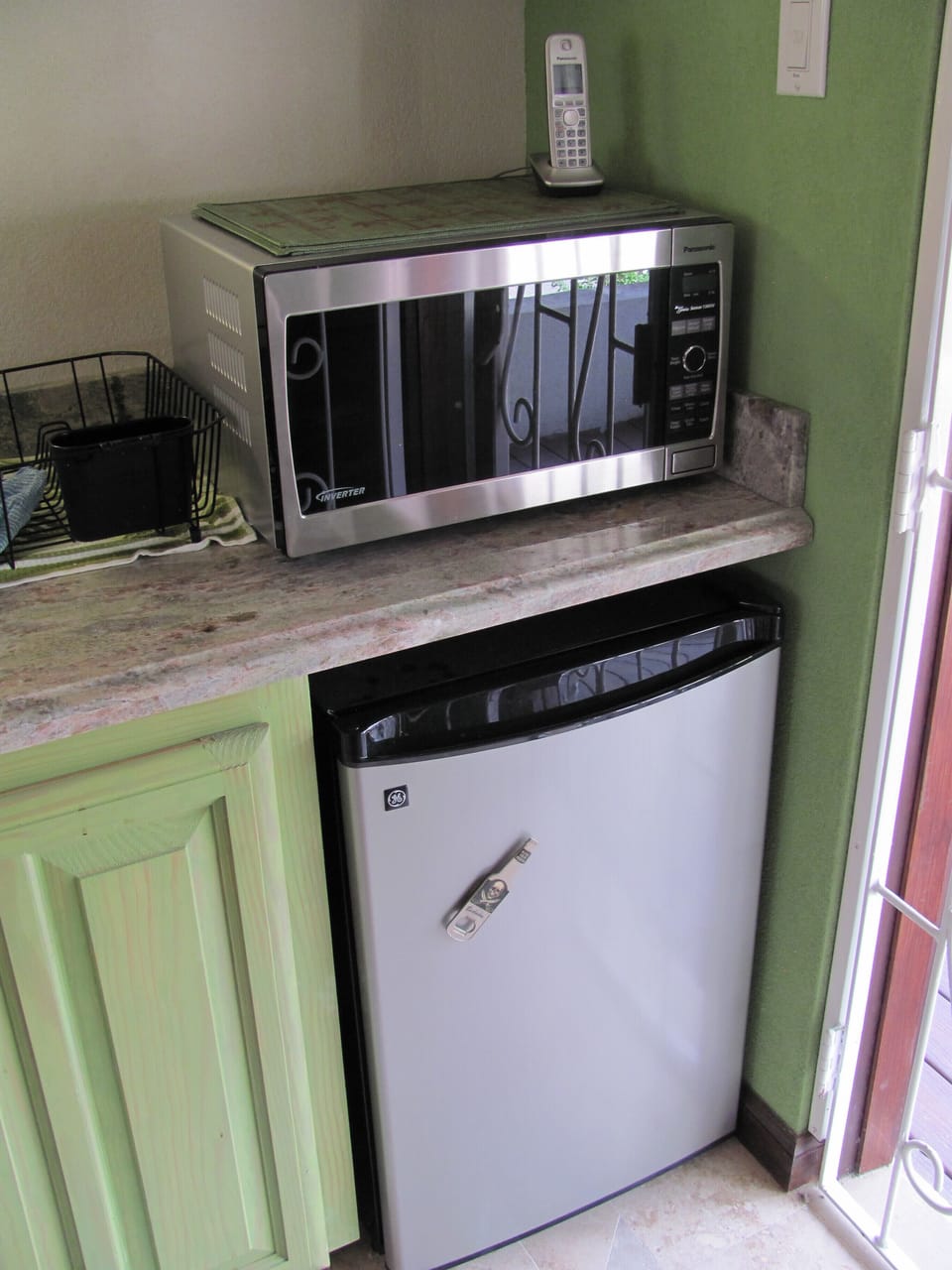 Microwave and small refrigerator.