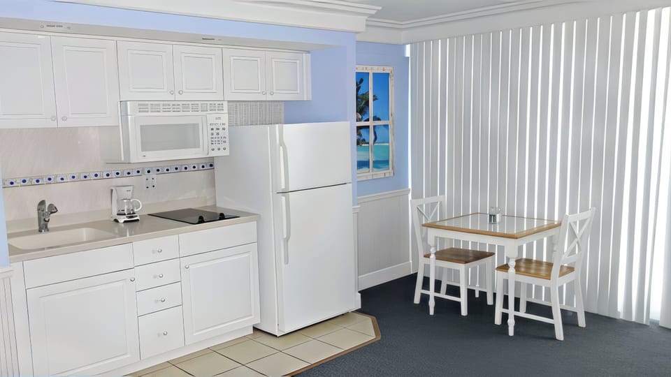 KITCHEN DINING AREA: Smooth Cook Top - Full Size Microwave - Full Size Refrigerator
