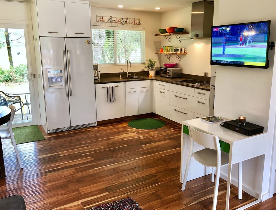 It’s one big great room - kitchen, living, dining and TV area all in one.  