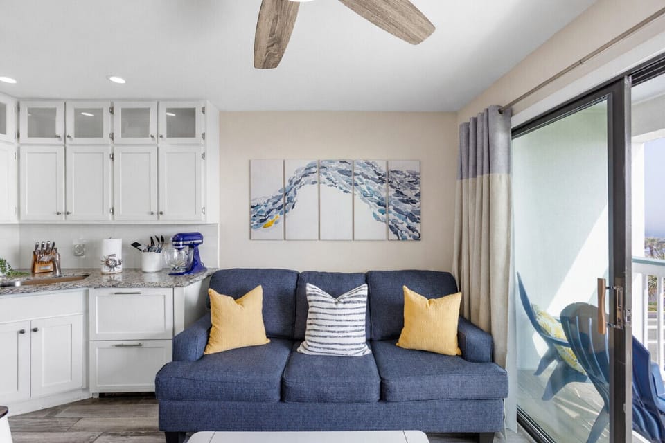 Extra sleeping space for the crew—living room queen sleeper sofa in this Casa del Mar condo, perfect for families and event weekends.
