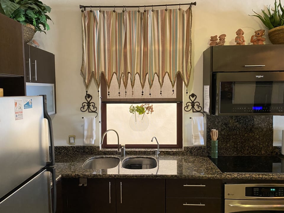 Kitchen sink with extra faucet for bottled water