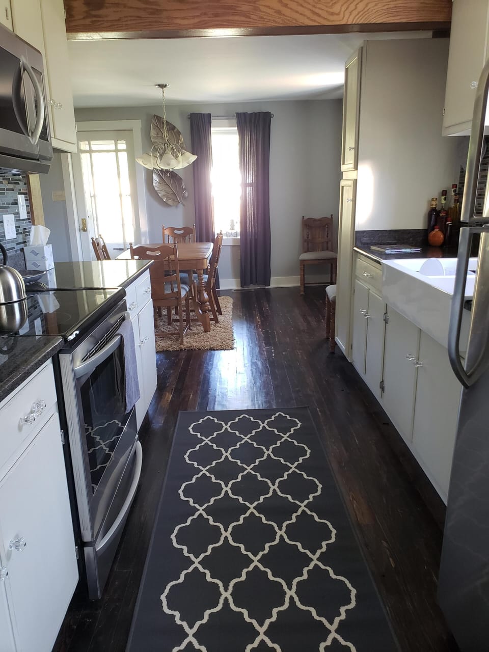 Galley kitchen and dining room