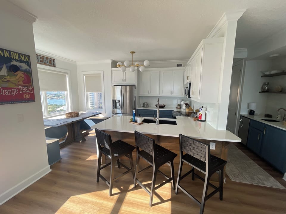Eat in kitchen with seating for 3 at bar and seating for 6 at kitchen banquette
