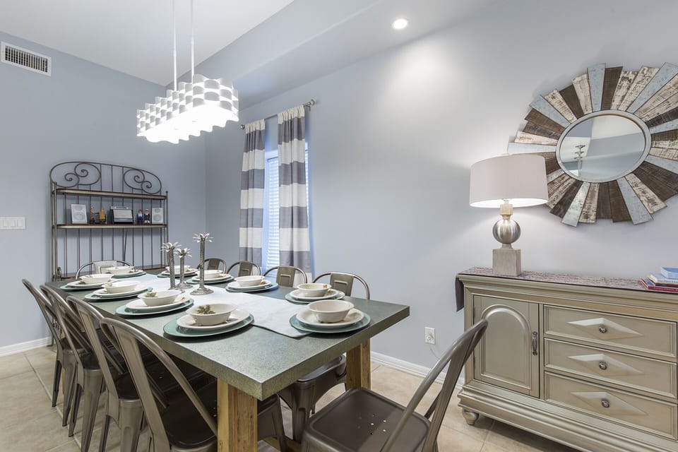 Enjoy meals together around the dining room table with plenty of natural light.