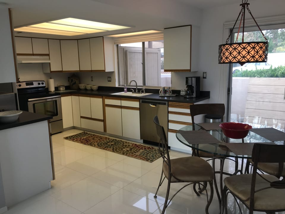 Kitchen has a stove, oven, dishwasher, microwave, and French-door refrigerator.