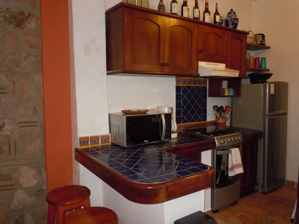 Equipped kitchen with gas stove and oven; plenty of counter and storage space