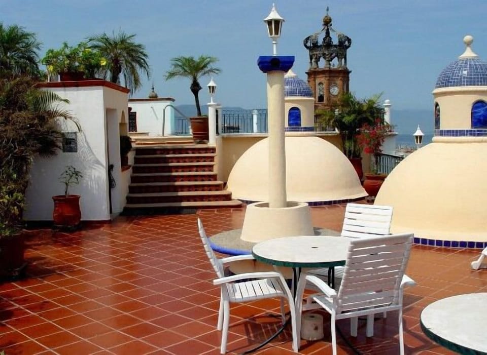 rooftop terrace with tables and seating. Your oasis in the heart of the city