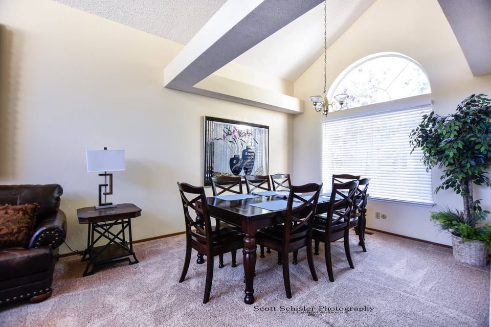 DINING ROOM OVERLOOKING BACK YARD AND DECK