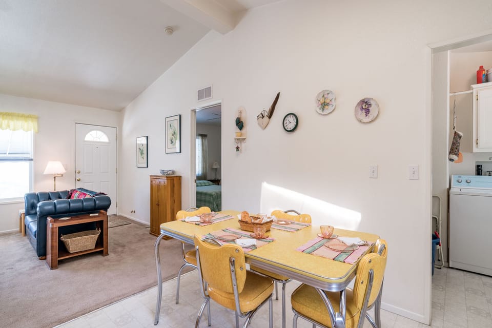 Front door leads to living room and open kitchen.