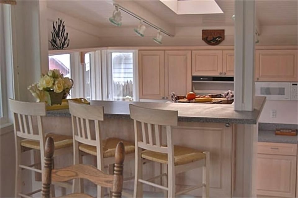 Counter Seating near Kitchen and Dining Area 