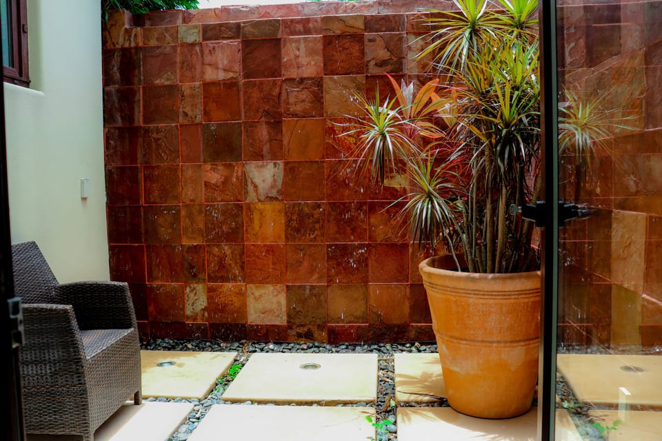 Sitting area off downstairs master with outdoor shower and water feature
