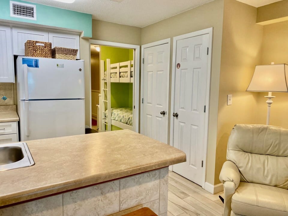 Another view of Kitchen, hallway with bunk sleeping. Pocket door to close off.
