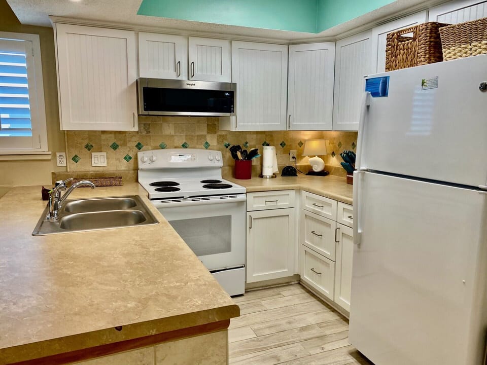 Kitchen - stove, microwave, dishwasher, refrigerator, small appliances. 