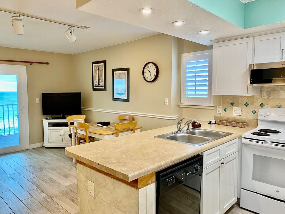 Another view of Dining area; Kitchen bar with overhead lighting.