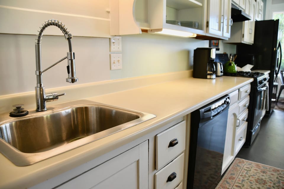 Stainless steel sink, full kitchen, and kitchen ware: pots/pans etc. Dishwasher