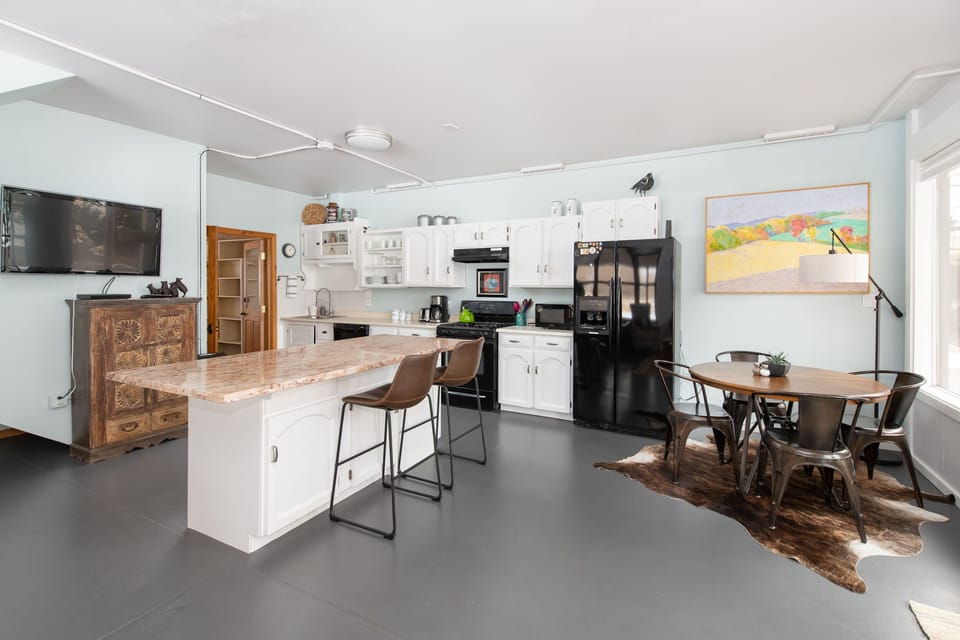 Ground floor overview. Smart TV and DVD player. Farmhouse Modern design.