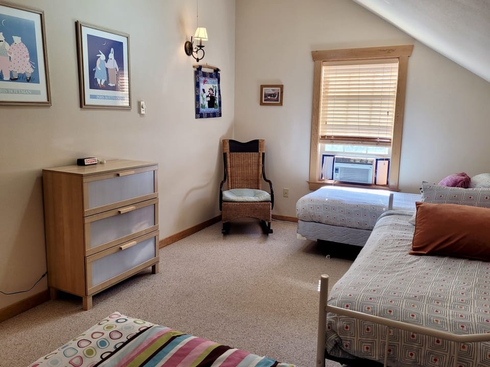 The third bedroom (upstairs) has three twin beds and a trundle bed (for two).
