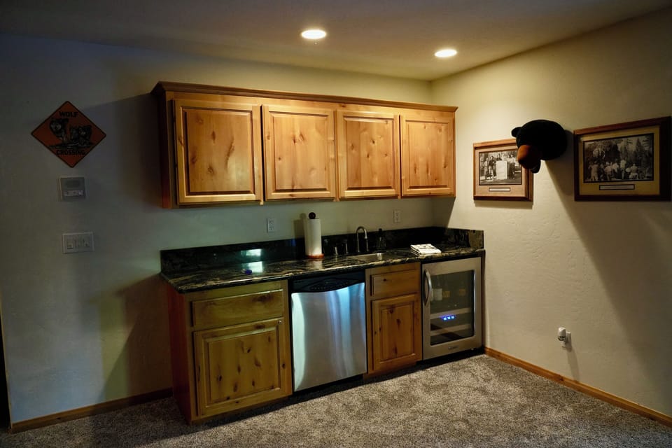 Game room wet bar, wine cooler and second dishwasher.