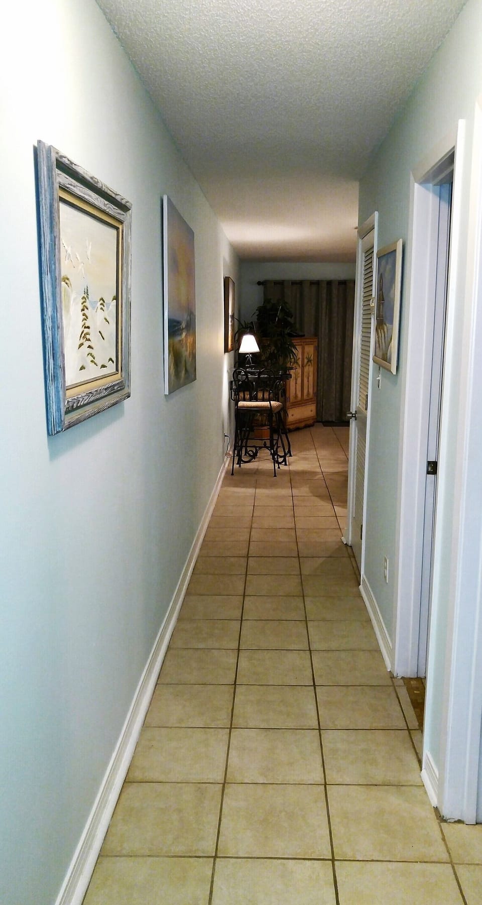 Front door hallway. Bedroom w/1/2 bath on first right. Full bathroom 2nd right. 