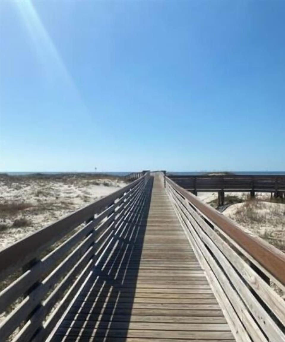 Scenic boardwalk leading to the sugar white sand Gulf beaches
