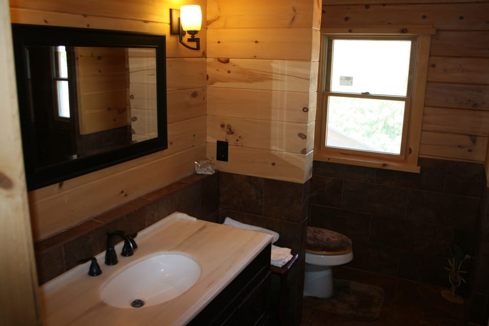 This is the bathroom upstairs. Walk-in Shower in seen in the mirror.