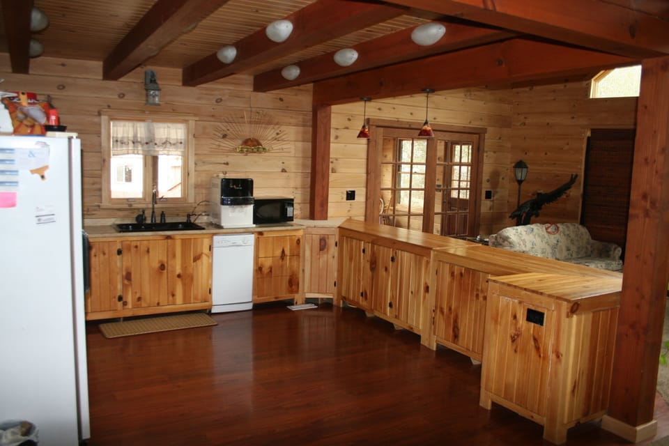 There is plenty of elbow space in this kitchen with custom cabinets  from lodge.