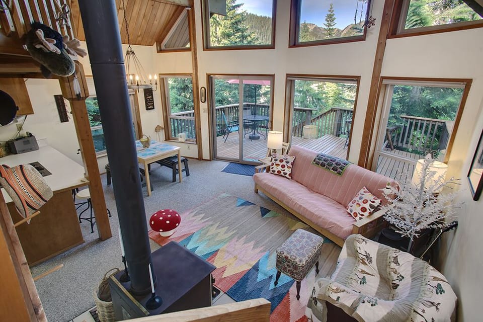 View of living room from staircase leading to loft.